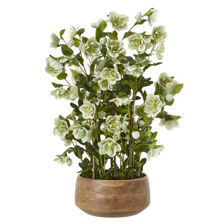 Artificial green hellebore plant in a round taupe pot, shown front-on against a white background.