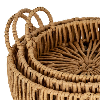 Close-up view of the natural paper rope material, highlighting the texture of the loop handles and the circular weave base.