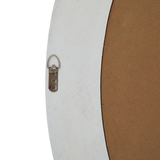 The back of the antique white wood frame, showing the metal D-ring hanger and the brown backing board.