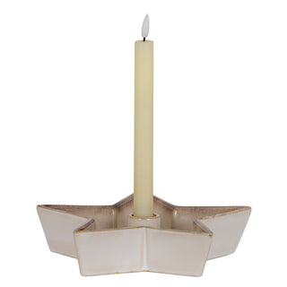 Front view of the large star-shaped ceramic candle holder with a cream LED taper candle.