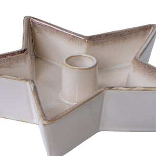 Close-up, angled view of the star candle holder showing the speckled brown rim and central socket.