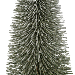 Close-up showing the texture of the dark green brush tree bristles covered in white flocking.