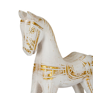 Close-up detail of the rocking horse's head, neck, and gold painted bridle.