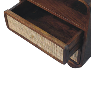 Close-up of the chestnut nightstand showing the top cane-fronted drawer pulled open.
