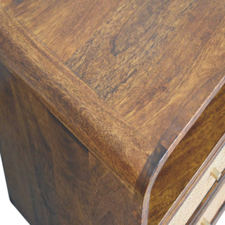 Detail shot showing the rich chestnut wood surface texture and the curved top corner.