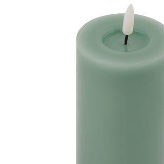 Close-up of the sage wax texture and the recessed top surrounding the faux flame.