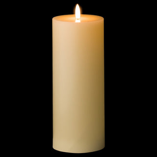 Cream LED candle glowing warmly in the dark, highlighting the realistic faux flame.