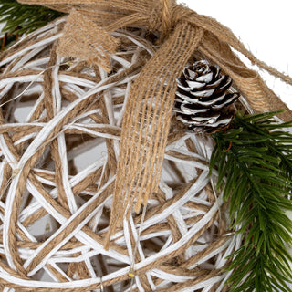Close-up detail of the white and natural rattan weave, jute ribbon, pinecone, and LED wire.