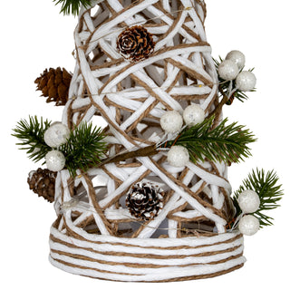 Close-up detail of the white and natural woven rattan texture, pine cones, frosted berries, and LED lights.