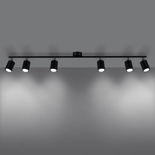 Six black spotlights on a horizontal track, switched on and directing light onto the surface below.