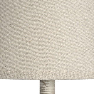 Close detail of the cream fabric lamp shade, highlighting the coarse, natural weave texture.
