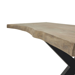 Detail of the light acacia tabletop showing the natural, irregular live edge contour.
