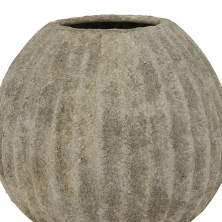 Detail shot of the vase's upper body, emphasising the rough texture and vertical fluting.