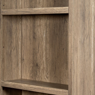 Close-up detail of the bookcase interior showing the light brown wood-effect texture on the back panel and shelves.
