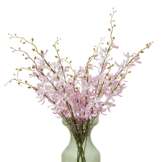 Artificial lilac cymbidium spray arranged in a translucent green glass vase against a white background.