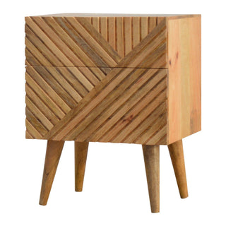 Detail shot highlighting the carved chevron pattern across the two drawer panels and the tapered wooden legs.