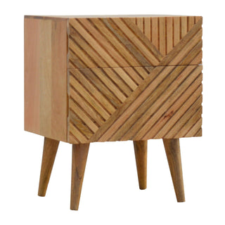Wooden nightstand viewed from an angle, showing the smooth side panel and the textured, diagonally carved drawer fronts.
