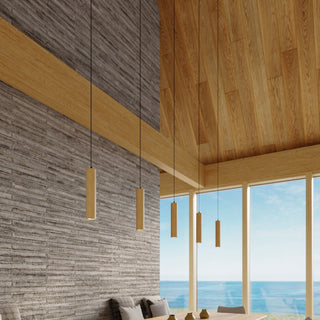 Four wooden cylindrical pendants suspended in a modern dining space with stone walls, wooden ceiling, and sea view.
