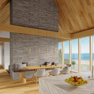 Five wooden pendants illuminate a dining area featuring a stone partition wall and exposed timber ceiling.