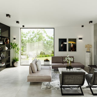Contemporary living room setting with multiple black cube ceiling lights providing ambient illumination.