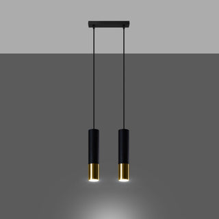 Cylindrical black and gold pendants seen front-on, with warm light shining from the base.