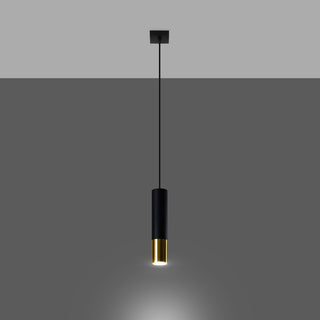 A slim black and gold pendant lamp switched on, casting a warm downward light.