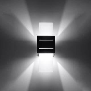 Illuminated black wall light showing the wide up/down wash and narrow horizontal light beams.