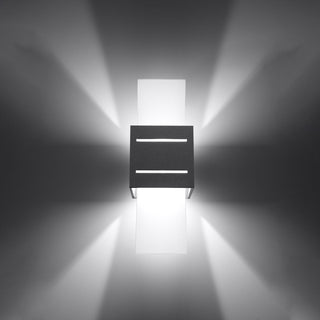 Grey wall lamp illuminated, showing up/down wall wash, front light lines, and angled side light beams.