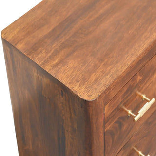 Close detail of the dark wood media unit showing the rounded top left corner and rich wood grain texture.