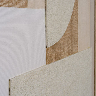 Angled detail showing the artwork's depth, contrasting woven linen, coarse stucco, and textured shapes.