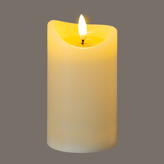 Full view of the cream LED candle, illuminated to show the soft, warm glow.