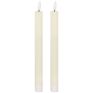 Plain front-on view of two ivory LED dinner candles with white bases and illuminated plastic flame tips.