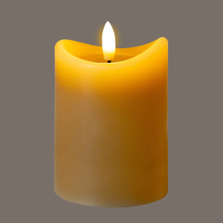 Flameless taupe candle glowing warmly, highlighting the melted wax edge and bright LED light.