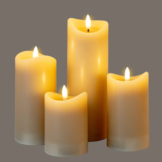 Close grouping of four lit taupe LED candles showing the internal glow and melted edges.