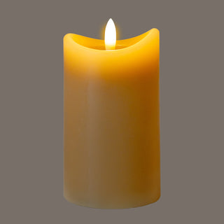 Taupe LED candle illuminated, showing a warm flickering glow effect on the curved top.