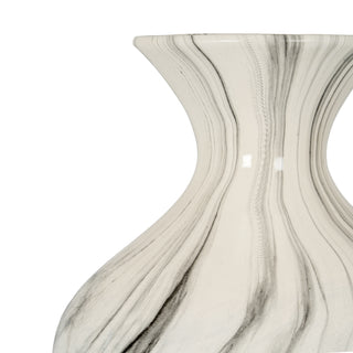 Detail of the vase's central curve, showing the vertical black and white marble effect and reflective surface.