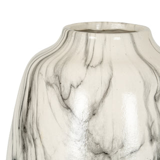 Close detail of the curved vase body showing the glossy finish and black marble patterning.