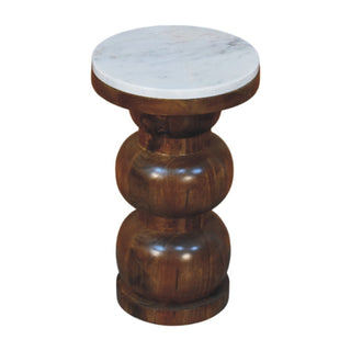 Angled product view of the side table with marble top and bulbous turned wood base.