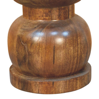 Close-up detail of the polished dark wood bulbous base and circular foot of the side table.