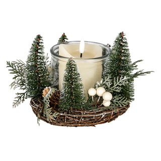 Close-up of the wreath showing the pinecone, white berries, and illuminated central candle.