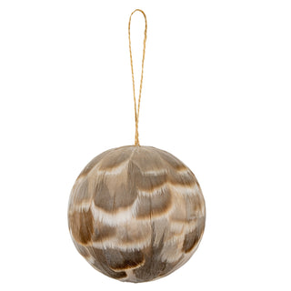 Plain front-on view of a round bauble covered in layered fawn and brown feathers, hanging from a twine loop.