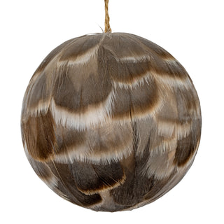 Close-up detail of the layered fawn, brown, and white feathers covering the round bauble.