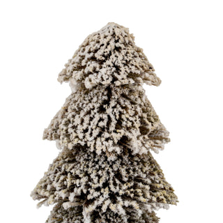 Close view of the tiered brush material covered in heavy, textured white snow flocking.
