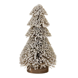 Tiered brush tree decoration heavily flocked with white snow effect, standing on a round brown base. Studio shot.