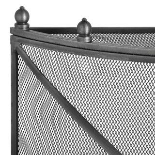 Corner detail of the fireguard showing the pewter effect frame, ball finial, and diamond mesh texture.