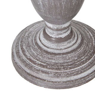 Close-up detail of the lamp base pedestal showing the circular texture and heavily distressed grey and white paintwork.