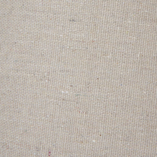 Tight close-up of the natural linen lampshade texture, showing the woven fibres.