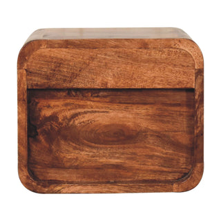 Front view showing the intense, swirling grain pattern of the honey-coloured wood on the drawer and open slot.
