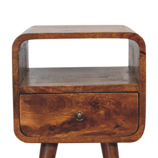 Close-up front view of the curved chestnut bedside unit showing the open shelf and single storage drawer.