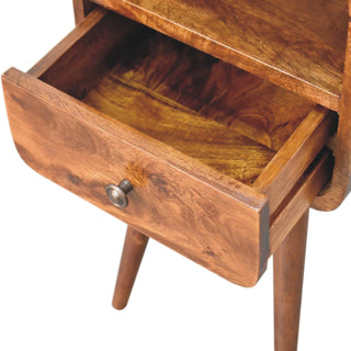 Close-up of the chestnut bedside table with the drawer open, showing the interior storage space.